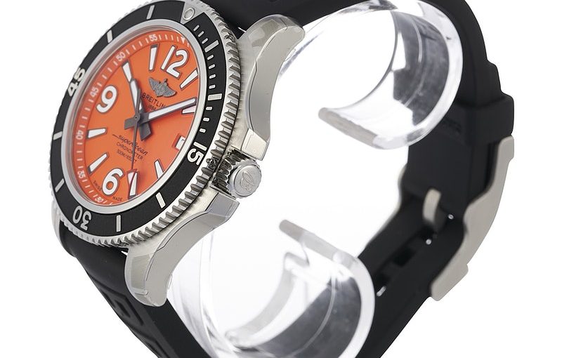 The stainless steel fake watch has an orange dial.